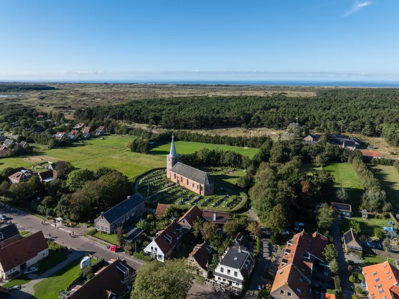 Aerial view of Hoorn with the church, the dunes and the North Sea